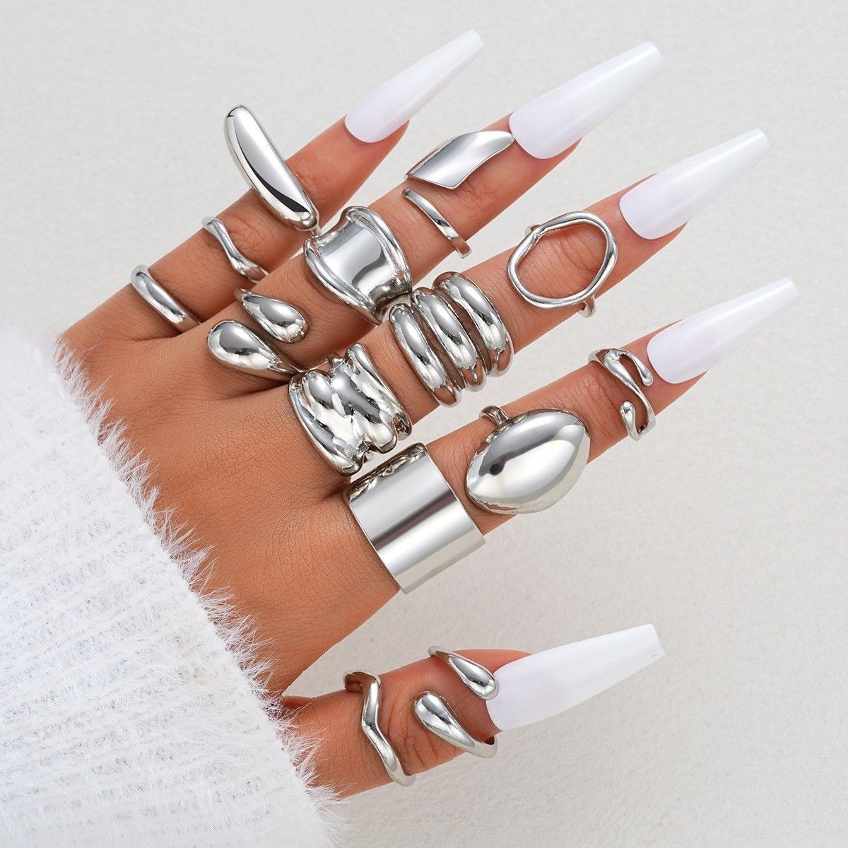 Irregularly Shaped, Smooth, Curved Rings, 14-Piece Set, Silver.